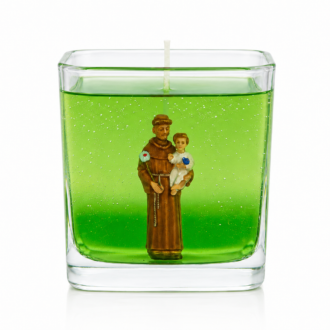 Vela em gel verde transparente com imagem de Santo Antônio segurando o Menino Jesus, acondicionada em recipiente quadrado de vidro. A peça apresenta design elegante e minimalista, destacando a figura religiosa em meio ao gel translúcido, transmitindo uma atmosfera de fé, proteção e serenidade.
