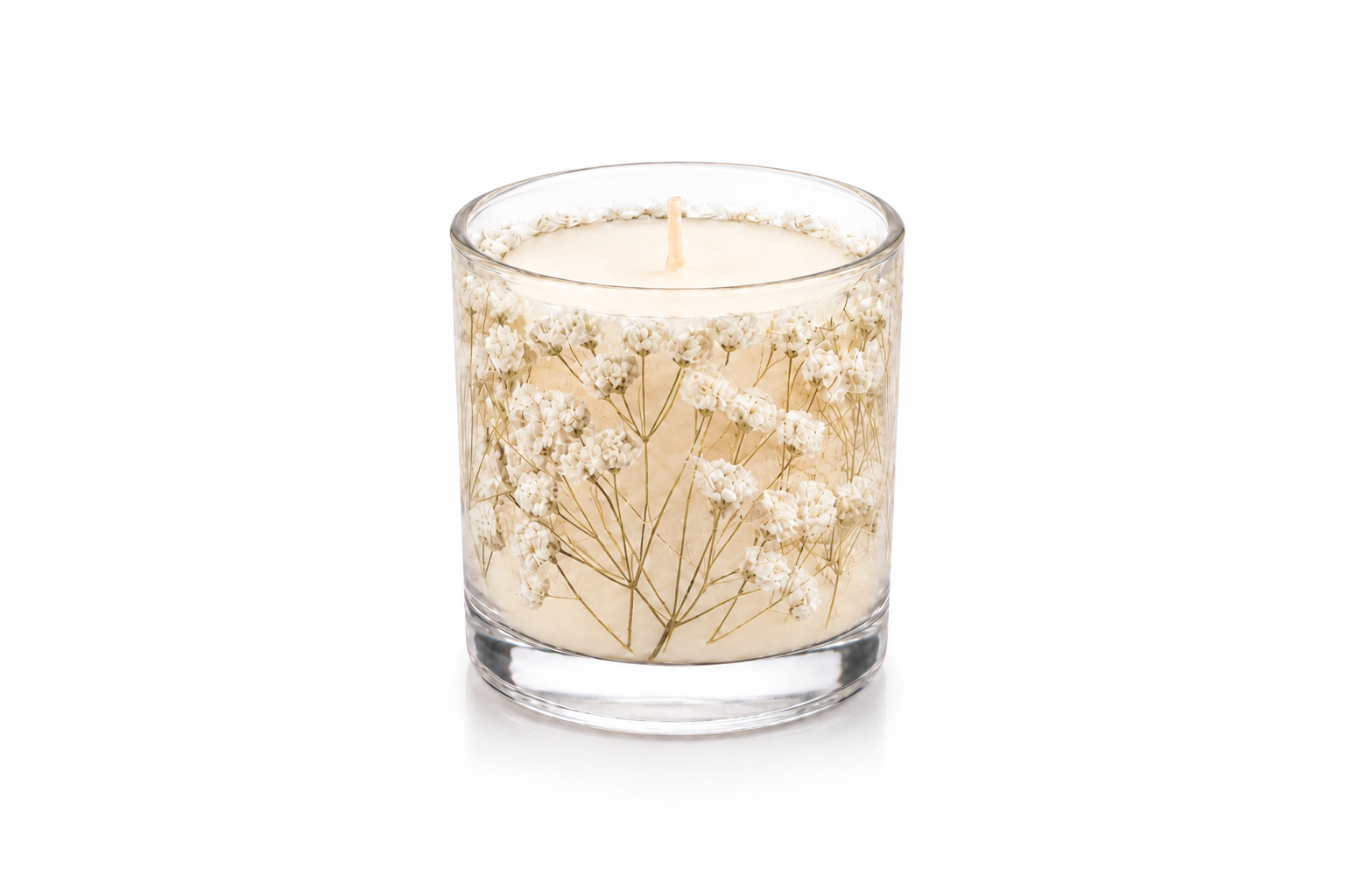 Vela Luminária Gypsophila artesanal em vidro transparente, decorada com delicadas flores brancas preservadas ao redor da cera, apresentada em fundo branco para catálogo.